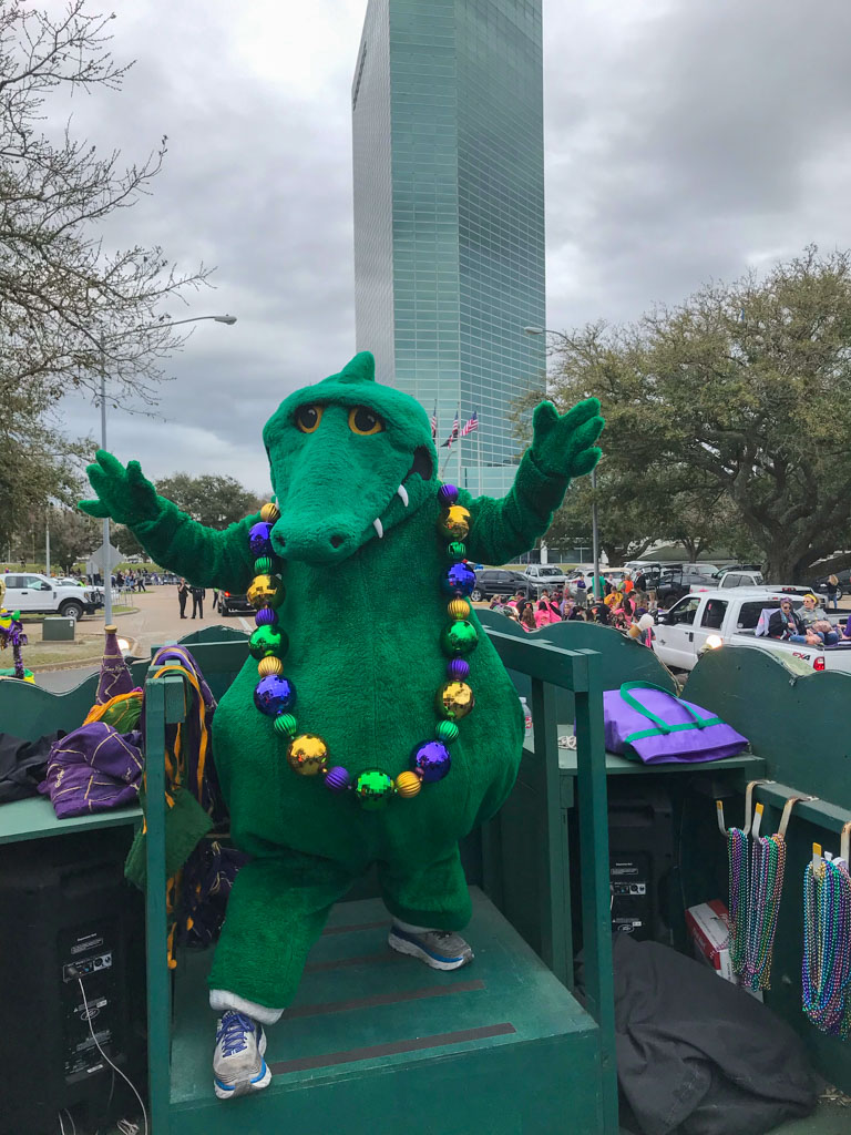Gumbeaux Gator riding on a parade float during the Children's Parade in Southwest Louisiana Mardi Gras